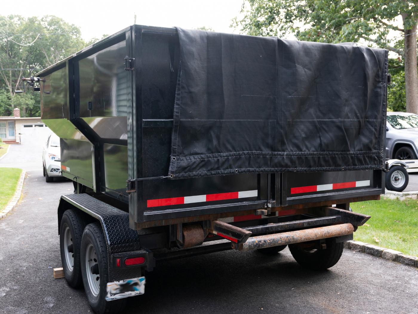 Loaded and tarped dump trailer ready to haul away